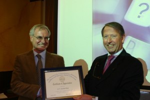 In February, Teus van der Plaat (l), head of the Research and Innovation Center, IVENT, receives a token of thanks from Cdre. Schoonderbeek.